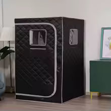 Sauna vapeur portable noir installé dans une pièce de maison avec cabine individuelle pliable